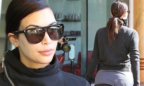 Kim Kardashian Stretches Her Spandex To The Limit As She Covers Her