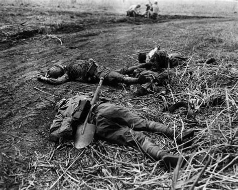 14th September 1942 Three Japanese Soldiers Lie Dead On The Ground