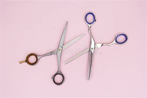 Scissors For Cutting Hair On A Pink Backgroundscissors For Thinning