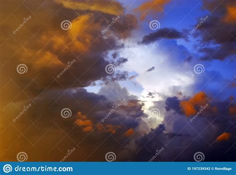 Amazing Cloudscape On The Sky At Sunset Time After Rain Stock Photo
