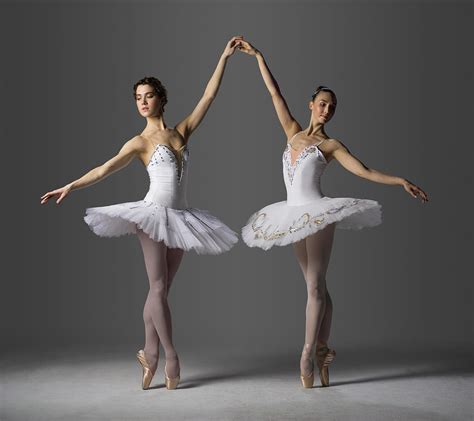 two ballerinas performing relevé on photograph by nisian hughes fine art america