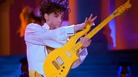 prince s guitar and a lock of bowie s hair fetch 150 000 at us auction bbc news