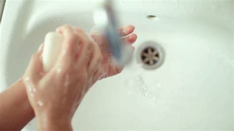 man soaping hands water flows from tap stock footage sbv 332606489 storyblocks