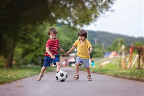 Two Cute Little Kids Playing Football Together Summertime Stock Photo