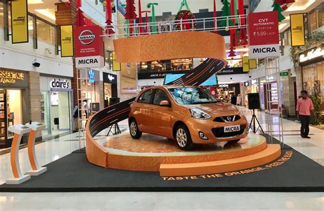 Nissan Micra Orange Cvt Automatic Mall Display Car Showroom Design