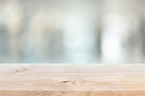 Wood Table Top On Blur Window Glasswall Background Stock Photo Image