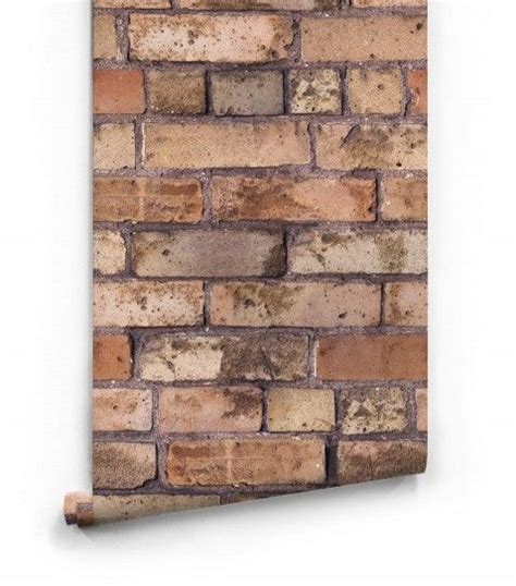 An Old Brick Wall Hanging On A White Wall