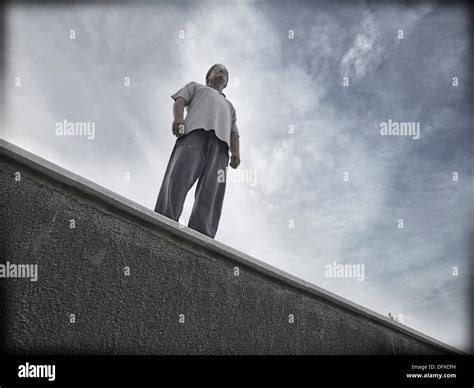 Single Man Standing On A Ledge Hi Res Stock Photography And Images Alamy