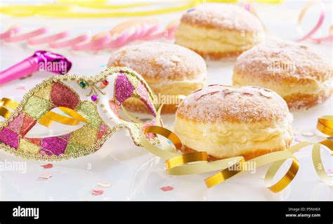 Carnival Powdered Sugar Raised Donuts With Paper Streamers And Venetian