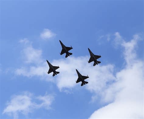 Premium Photo F16 Falcon Fighter Jet Flying On Blue Sky