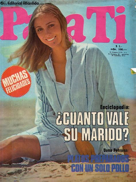 A Magazine Cover With A Woman Sitting On The Beach In Front Of Her And Smiling At The Camera