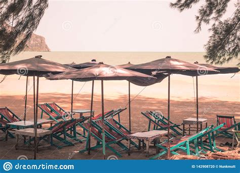 Photo Of Sun Beds In Popular Tropical Paradise Sandy Beach