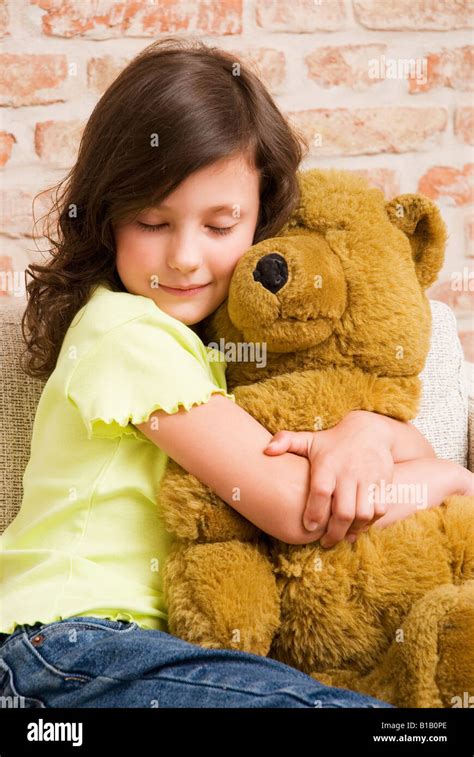 Girl 8 9 Hugging Teddy Bear Portrait Stock Photo Alamy