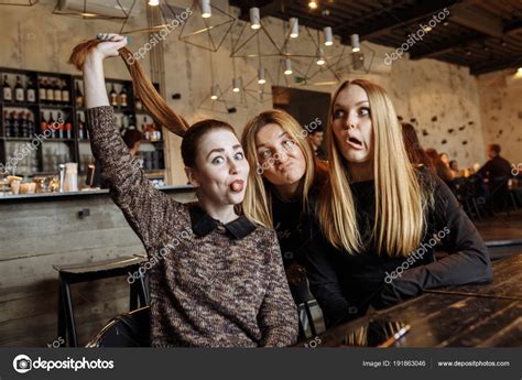 Happy Young Women Making Faces Table Cafe Stock Photo By ©svetaya 191863046