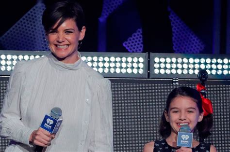 Suri Cruise Looks Just Like Mum Katie Holmes As They Introduce Taylor Swift On Stage At Jingle
