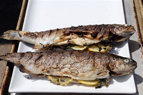Whole Grilled Rainbow Trout Stuffed With Lemon And Herbs Baked Trout Rainbow Trout Recipes
