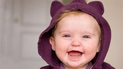 Smiley Ash Eyes Cute Baby Is Wearing Dark Purple Dress In