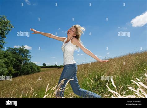 Woman Walking In The Countryside Stock Photo Alamy