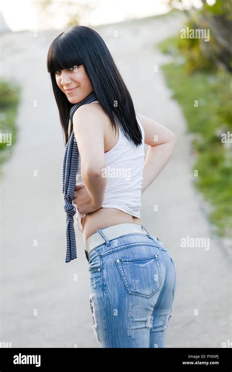 Pretty Teen Girl Posing Hands On Hips Slender Body Thin Looking Back Stock Photo Alamy
