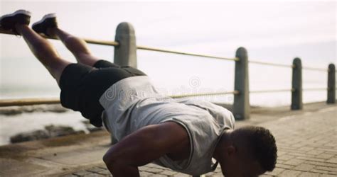 black man push up and exercise at the beach for fitness or training
