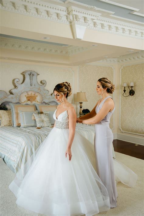 Our Breathtaking Bride Getting Ready With One Of Her Bridesmaids Who