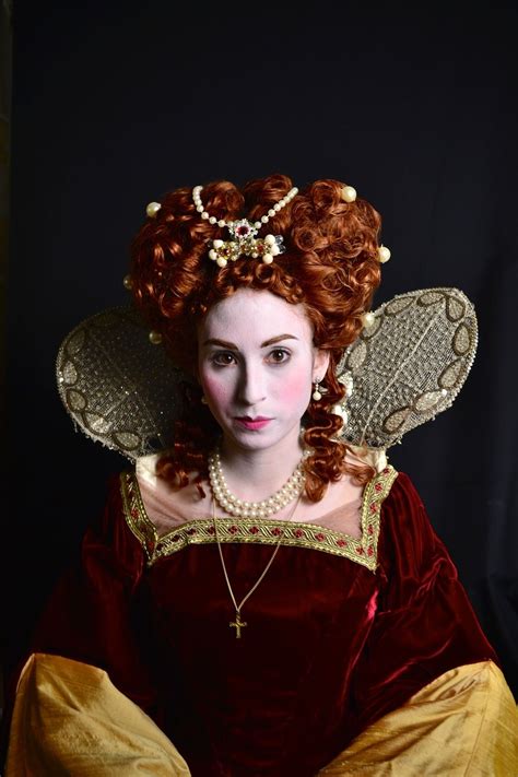 A Woman With Red Hair Wearing An Elaborate Dress And Pearls On Her Head