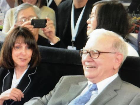 bill and cheryl with warren buffett at ping pong match at borsheim s in omaha nebraska omaha