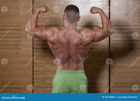 Muscular Man Flexing Back Muscles Pose Stock Photo Image Of Caucasian