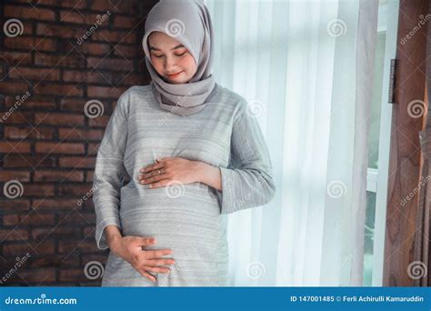 Pregnant Muslim Woman Suffering Labor Pain At Home Her Husband Calling