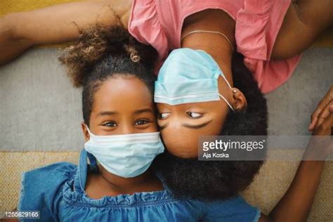 Young Black Woman Wearing A Mask Imagens E Fotografias De Stock Getty Images