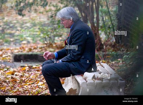 Former Conservative Chief Whip Andrew Mitchell Mp Sits On A Park Bench