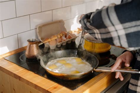 Person Cooking On Black Cooking Pan · Free Stock Photo