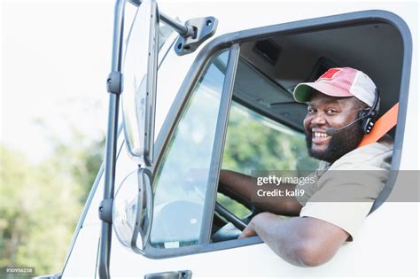 Africanamerican Truck Driver In Drivers Seat High Res Stock Photo