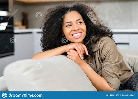 Portrait Of The Multiracial Woman In Home Interior Charming Lady Looking Away And Smiles