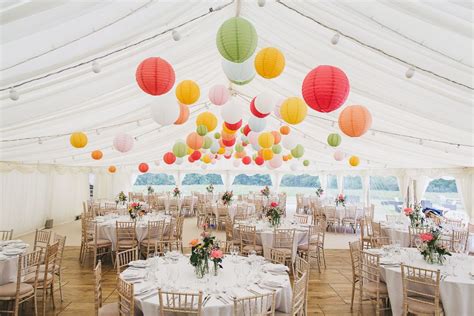 Colourful Hanging Paper Lantern And Wild Flower Filled Marquee Wedding