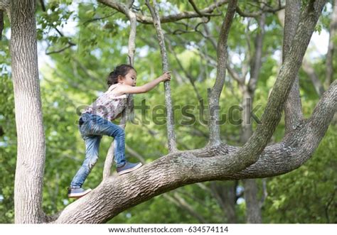 Happy Little Girl Climbing Tree Stock Photo Edit Now 634574114