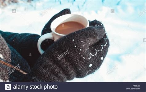 Warm Cup Of Hot Coffee Warming In The Hands Of A Girl Stock Photo Alamy