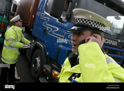 British Traffic Police Officers Checking On Long Distance Lorry Stock