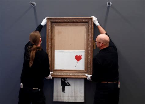 Banksy Shredded Painting Auction Banksy Shocks Art World By Shredding