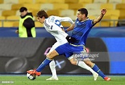 Dynamo's midfielder Denys Harmash vies with Maccabi's defender Eitan ...