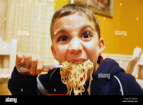 Boy Eating Pasta Stock Photo Alamy