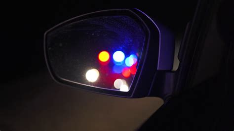 Flashing Police Lights Reflected In Rearview Stock Footage Sbv