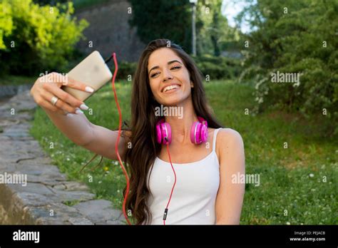 Pretty Teen Girl Taking Selfies With Her Smart Phone Stock Photo Alamy
