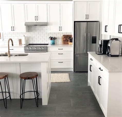 White and gray painted cabinets, countertop and backsplash choices and update ideas for any decorating a white or gray kitchen with black appliances. Farmhouse goals! A bright white kitchen toned down with sophisticated and elegant matte black ...