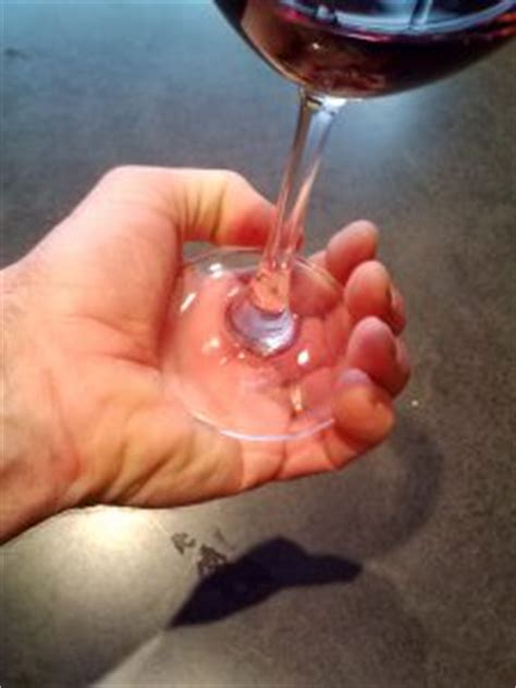 Instead of holding your glass at the base of the bowl (aka where the wine sits in your glass), you should actually hold it as close to the bottom of the wine stem as you can using your thumb and. How To Hold A Wine Glass: The Right Way, The Wrong Way, And Whatever Way You're Doing It Right ...