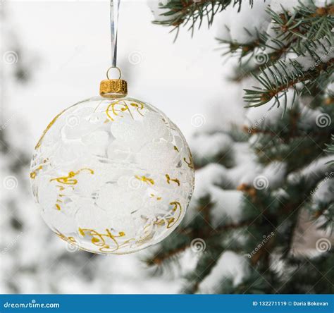 Crystalline Christmas Tree Ball On A Snow Covered Tree Branch Stock