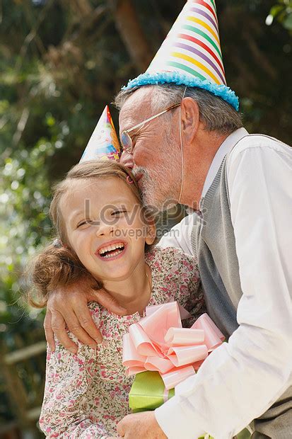 grandpa kissing granddaughter at party picture and hd photos free download on lovepik