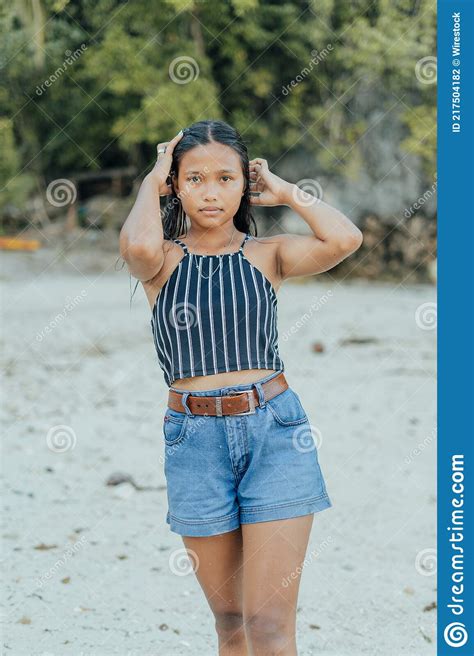 Portrait Of A Beauitful Brown Skin Filipina Model On A White Sand Beach
