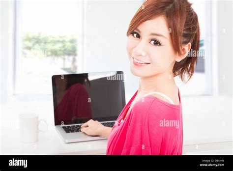 Smiling Young Woman Sitting With Laptop Computer Stock Photo Alamy
