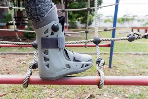 Broken Leg The Splint For Treatment Of Injured Woman On Play Ground